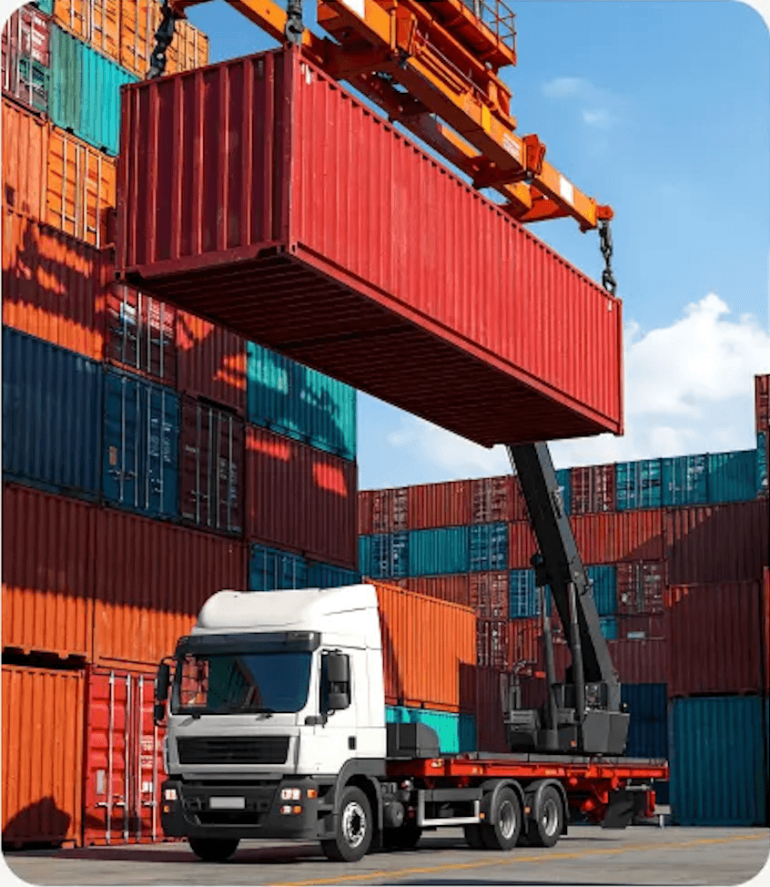 Crane lifting container onto freight truck